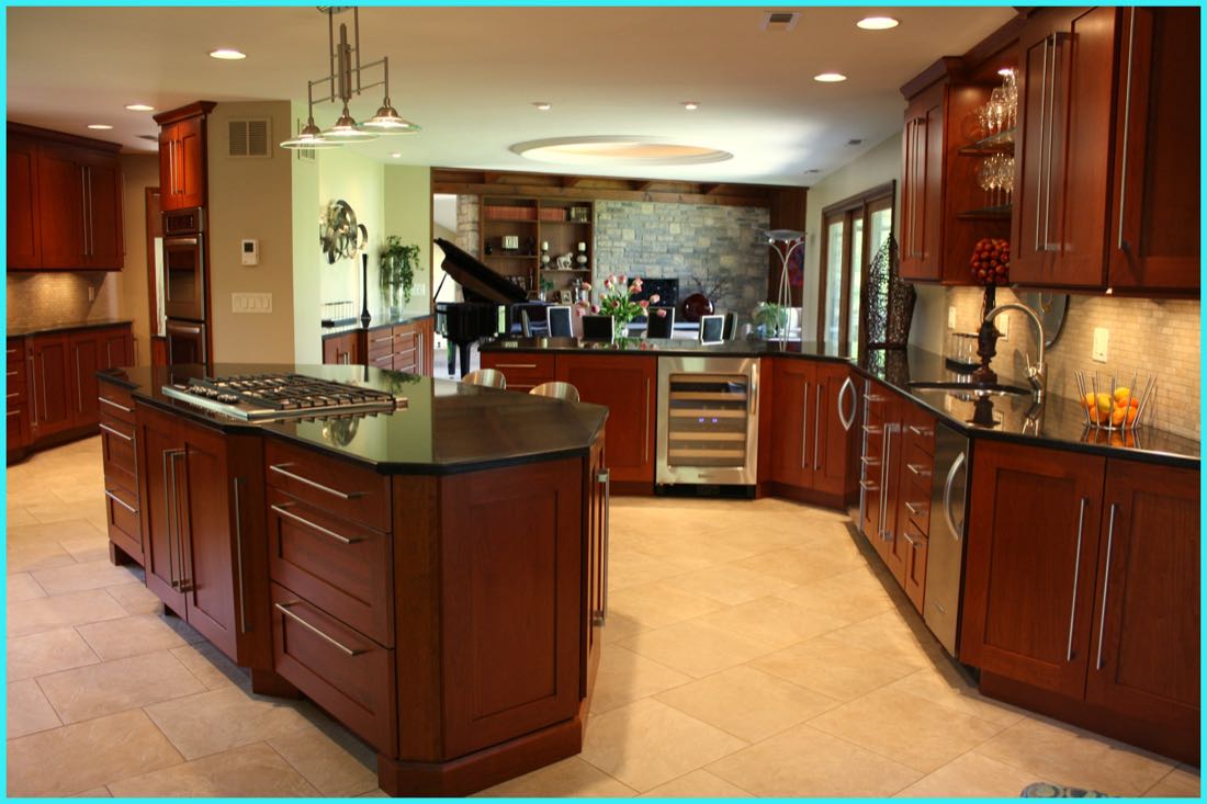 Remodeled kitchen with dark wood cabinets and stone counters